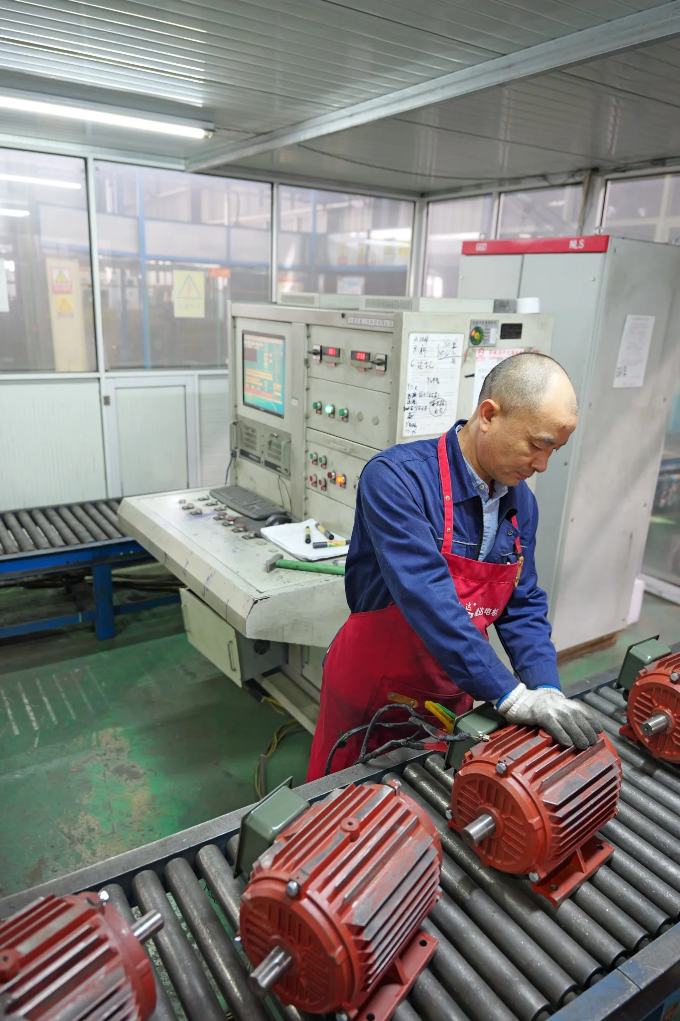 Electric motor assembly line with assembled motors and testing area