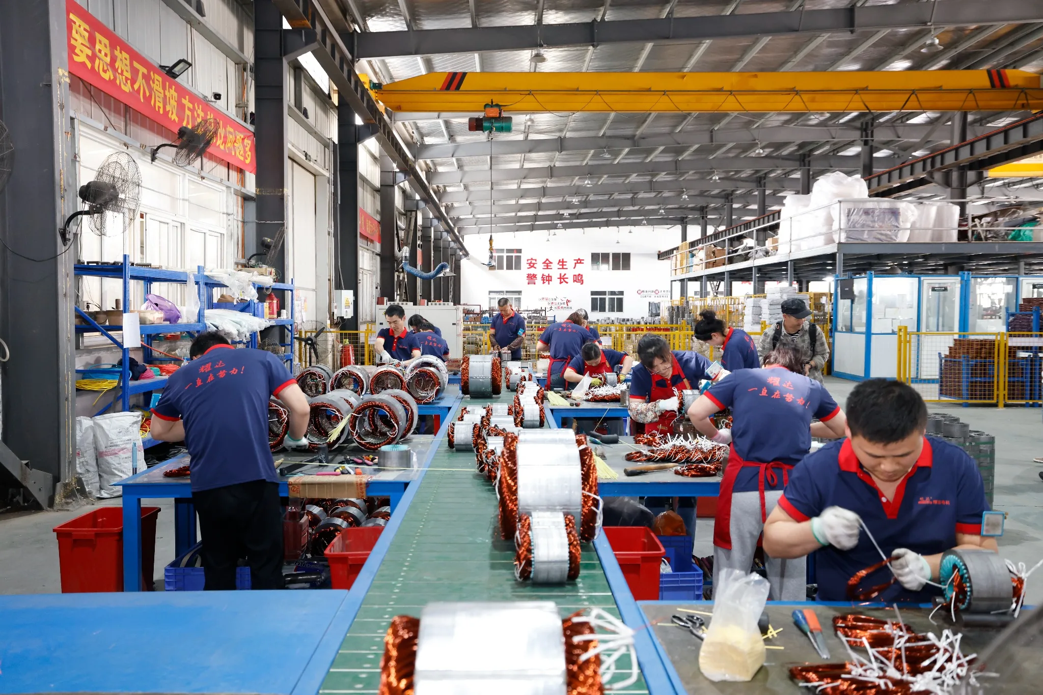 Motor stator inserting production line with workers