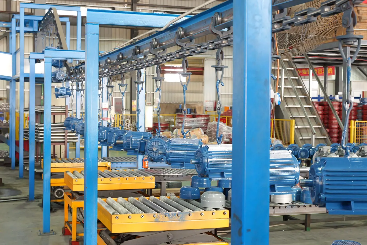 Motor packaging process with workers preparing finished electric motors