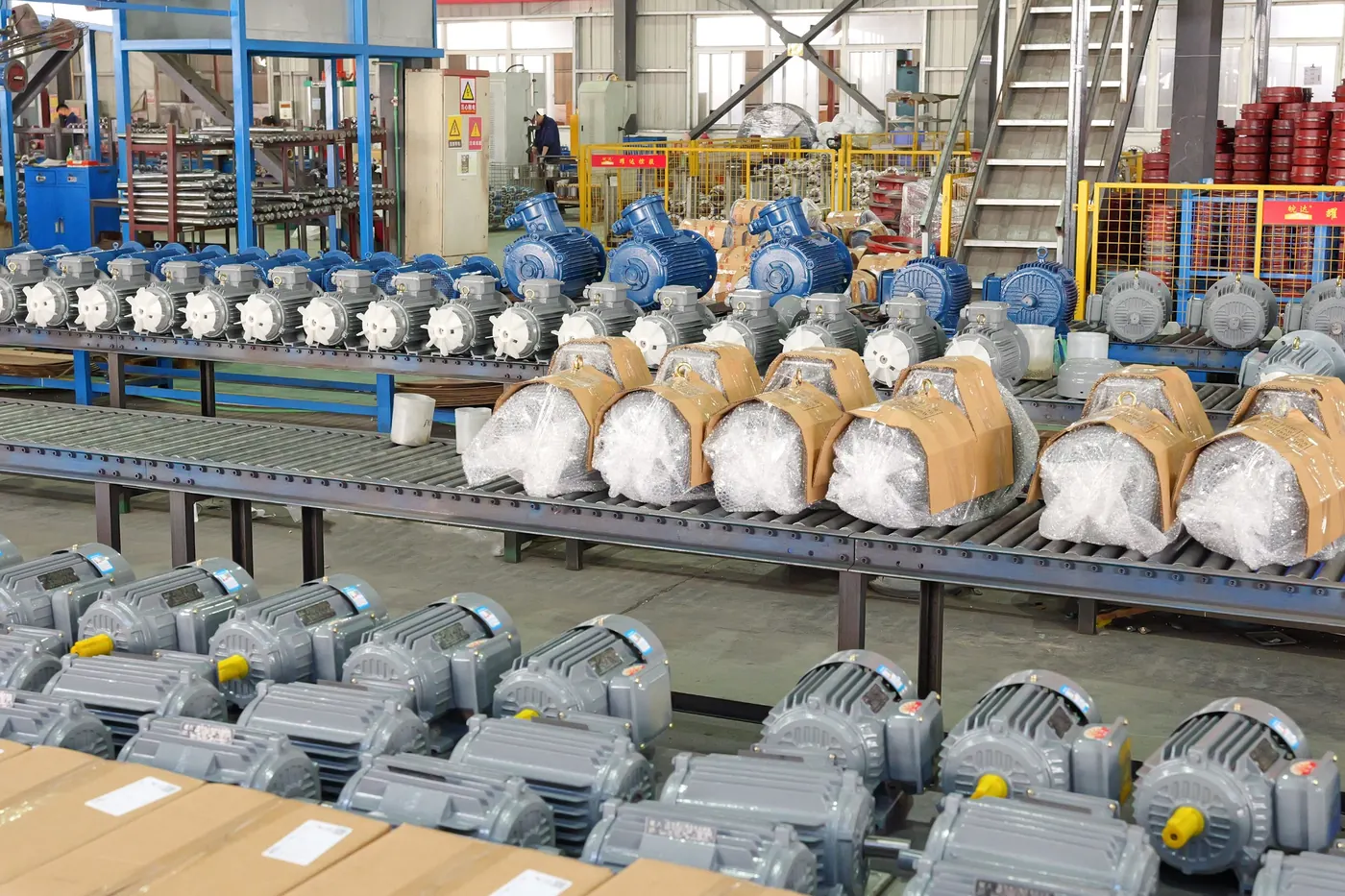 Batch motor preparation area with cartons and finished motors